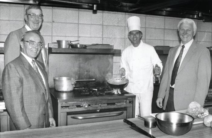 SUNY Niagara Foundation Board of Directors members Norm Sinclair and Eugene Swenson; Culinary Arts Professor Sam Sheusi; and Alan Van DeMark, 1991