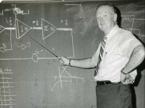 SUNY Niagara Professor Emeritus James Kimbrough demonstrating mathematical formulas, circa 1982