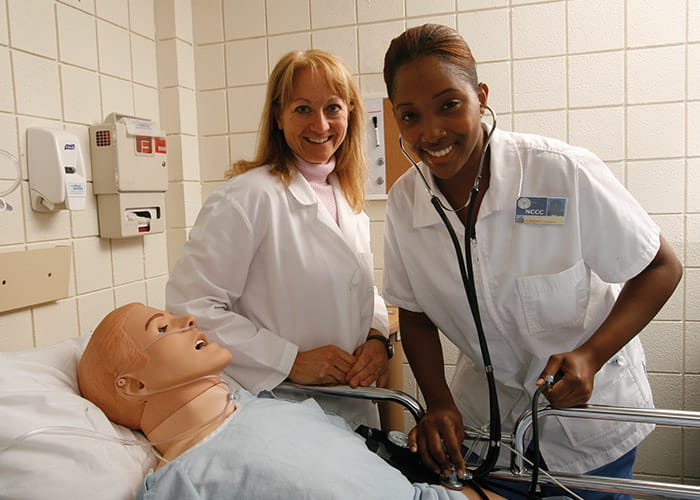 SUNY Distinguished Professor, Dr. Julie Woodworth with SUNY Niagara RN student in nursing lab.